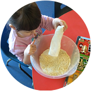 Nursery children loved mixing ingredients to make pancake batter on Pancake Day.